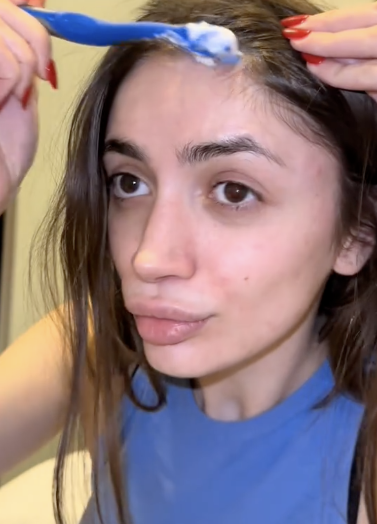 woman doing her hair